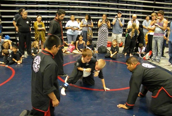 young students grappling